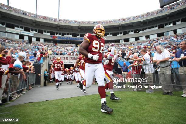 Albert Haynesworth of the Washington Redskins heads to the field before the game against the Carolina Panthers at Bank of America Stadium on October...