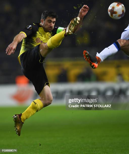 Dortmund's Greek defender Sokratis plays the ball during the UEFA Europa League round of 32, first leg football match of Germany's Borussia Dortmund...