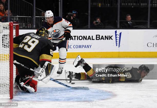 Ryan Strome of the Edmonton Oilers takes a shot against Marc-Andre Fleury and Nate Schmidt of the Vegas Golden Knights in the third period of their...