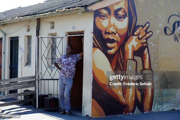 Mural painting and graffitis in the township of Khayelitsha in Cape Town. Khayelitsha is the largest and fastest growing township in Western Cape,...