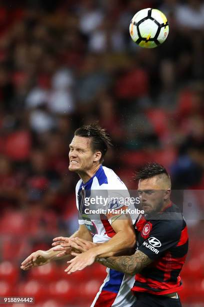 Nigel Boogaard of the Jets and Josh Risdon of the Wanderers compete for the ball in the air during the round 20 A-League match between the Western...