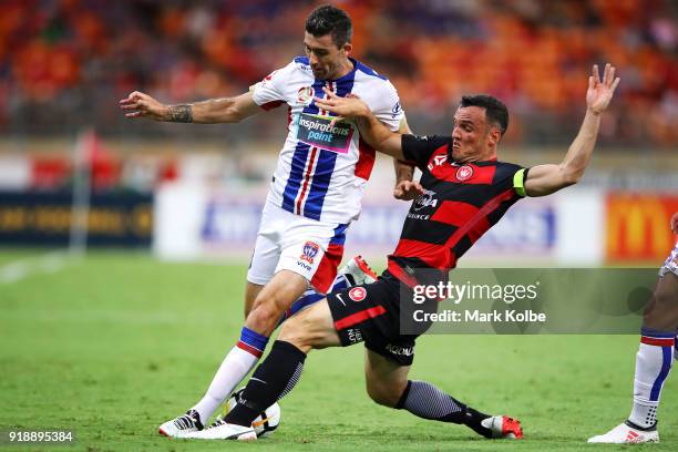 Jason Hoffman of the Jets is tackled Mark Bridge of the Wanderers during the round 20 A-League match between the Western Sydney Wanderers and the...