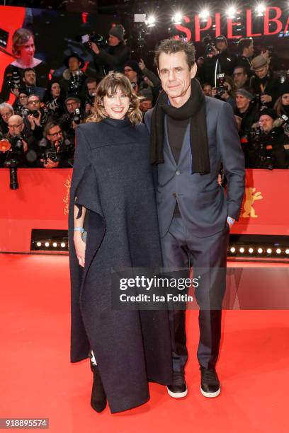 German director Tom Tykwer and his girlfriend Marie Steinbach attend the Opening Ceremony & 'Isle of Dogs' premiere during the 68th Berlinale...