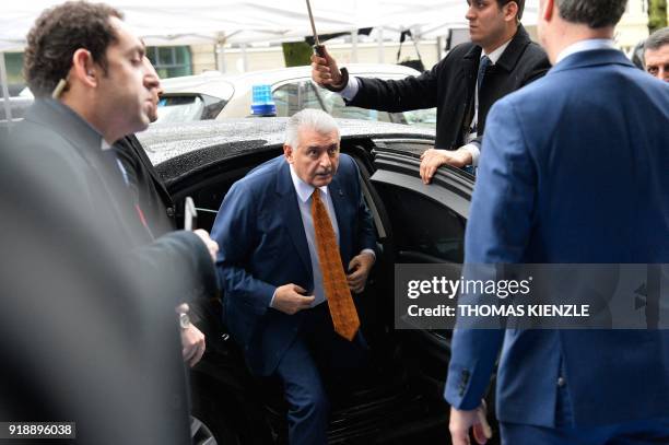 Turkish Prime Minister Binali Yildirim gets off his car as he arrives at the Bayerischer Hof hotel in Munich, southern Germany, venue of the 54th...