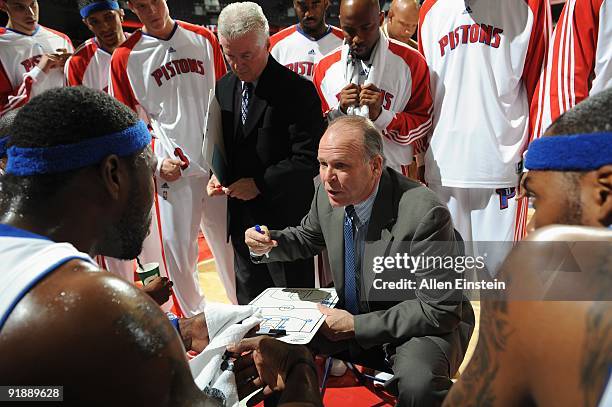 Head coach John Kuester of the Detroit Pistons talks in the huddle during the preseason game against the Milwaukee Bucks at the Palace of Auburn...