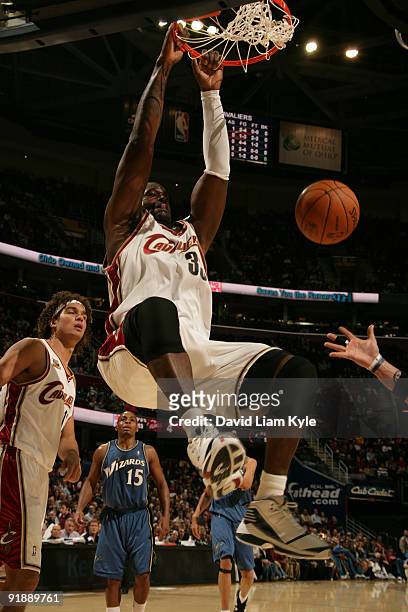 Shaquille O'Neal of the Cleveland Cavaliers slam dunks the ball against the Washington Wizards at The Quicken Loans Arena on October 14, 2009 in...