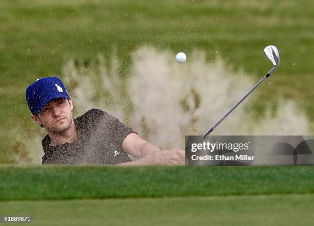 Singer Justin Timberlake hits out of a bunker on the 3rd hole during the Justin Timberlake Shriners Hospitals for Children Open Championship Pro-Am...