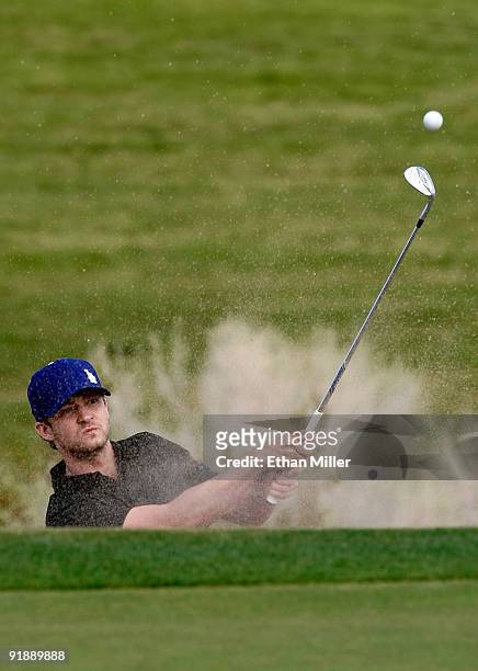 Singer Justin Timberlake hits out of a bunker on the 3rd hole during the Justin Timberlake Shriners Hospitals for Children Open Championship Pro-Am...