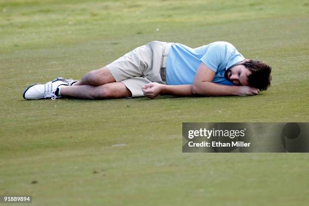 Singer/songwriter Josh Kelley lies down on the 9th hole fairway during the Justin Timberlake Shriners Hospitals for Children Open Championship Pro-Am...