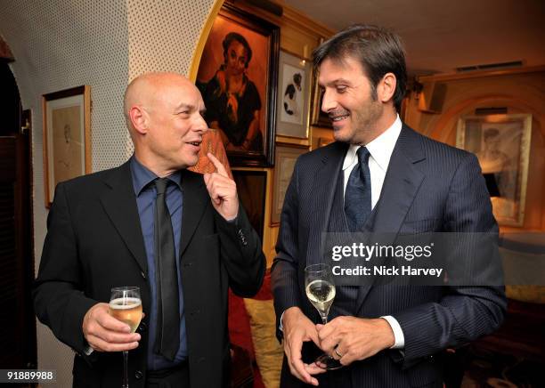 Music producer Brian Eno and Andrea Perrone attend a private dinner for Brioni hosted by Bryan Ferry at Annabel's on October 14, 2009 in London,...