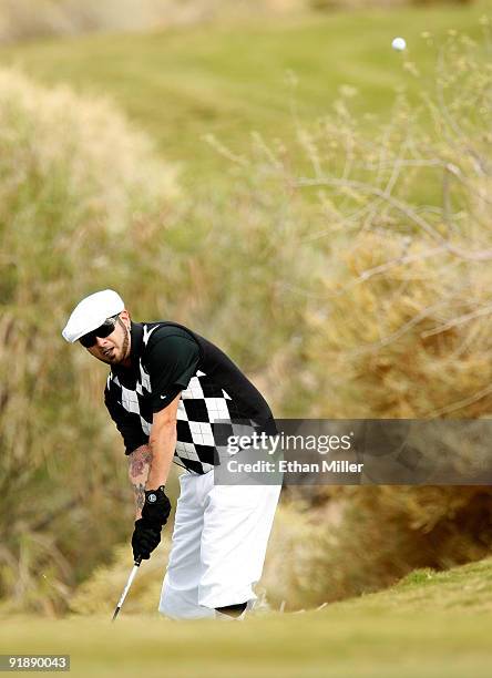 Singer Chris Kirkpatrick tries to hit onto the 3rd hole green during the Justin Timberlake Shriners Hospitals for Children Open Championship Pro-Am...