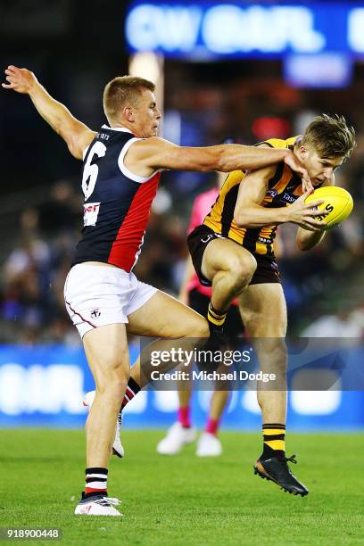 Dylan Moore of the Hawks marks the ball against Sebastian Ross of the Saints during the AFLX match between Hawthorn Hawks and St.Kilda Saints at...