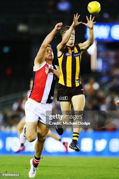 Dylan Moore of the Hawks marks the ball against Sebastian Ross of the Saints during the AFLX match between Hawthorn Hawks and St.Kilda Saints at...