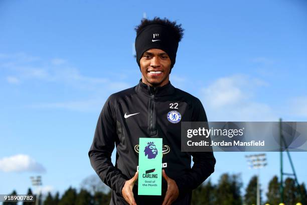 Willian of Chelsea poses with the trophy for Carling Premier League Goal of the Month for January 2018 at Chelsea Training Ground on February 15,...