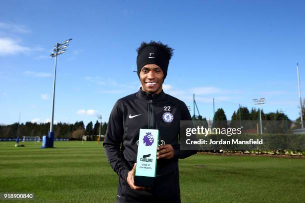 Willian of Chelsea poses with the trophy for Carling Premier League Goal of the Month for January 2018 at Chelsea Training Ground on February 15,...