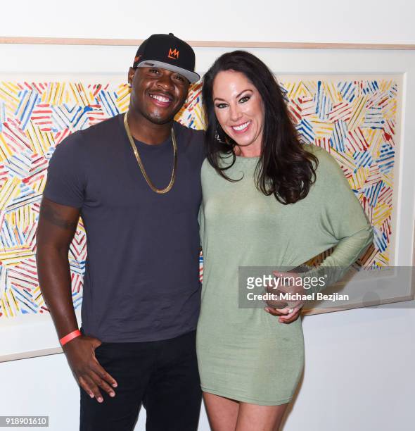 Desmond Mason and Rebecca Mason attend Amare Stoudemire hosts ART OF THE GAME art show presented by Sotheby's and Joseph Gross Gallery on February...