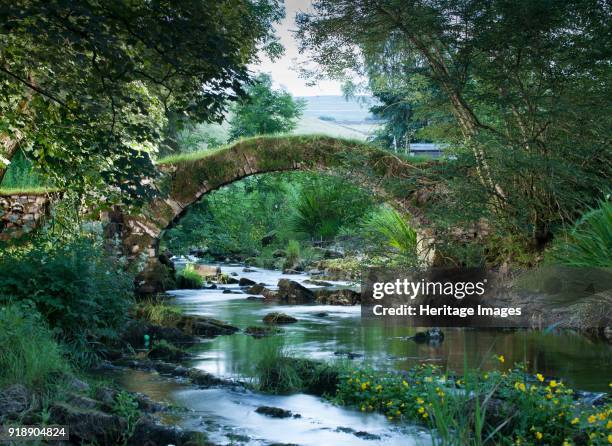 Medieval packhorse bridge, Fawcett Mill Fields, Gaisgill,Tebay, Cumbria, c2016. View looking downstream from the east. Artist Alun Bull.