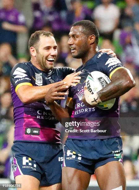Suliasi Vunivalu of the Storm is congratulated by Cameron Smith after scoring a try during the World Club Challenge match between the Melbourne Storm...
