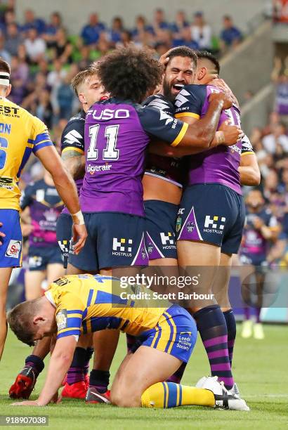 Jesse Bromwich of the Storm is congratulated by his teammates after scoring a try during the World Club Challenge match between the Melbourne Storm...