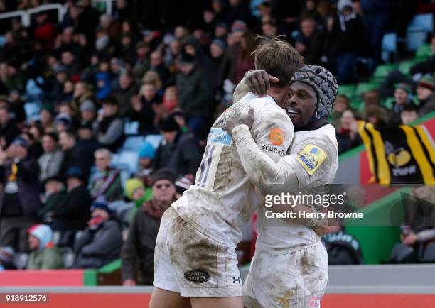 Josh Bassett of Wasps celebrates with Christian Wade after scoring a try during the Aviva Premiership match between Harlequins and Wasps at...