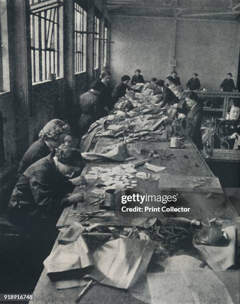 'Patching balloons', 1941. Women contributed to the war effort in many different ways, such as patching weather balloons. From Air of Glory, by Cecil...