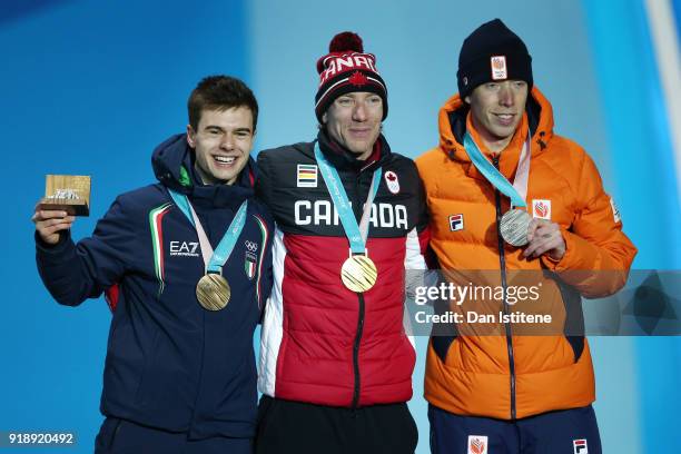 Bronze medalist Nicola Tumolero of Italy, gold medalist Ted-Jan Bloemen of Canada and silver medalist Jorrit Bergsma of the Netherlands celebrate...