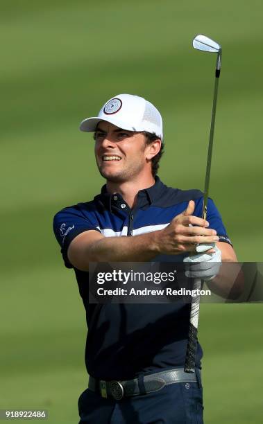 Laurie Canter of England plays his second shot on the par five 16th hole during the second round of the NBO Oman Open at Al Mouj Golf on February 16,...