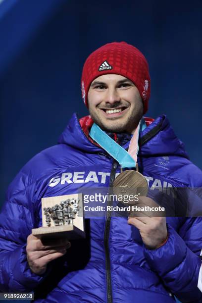 Bronze medalist Dom Parsons of Great Britain celebrates during the Medal Ceremony for Skeleton - Men on day seven of the PyeongChang 2018 Winter...