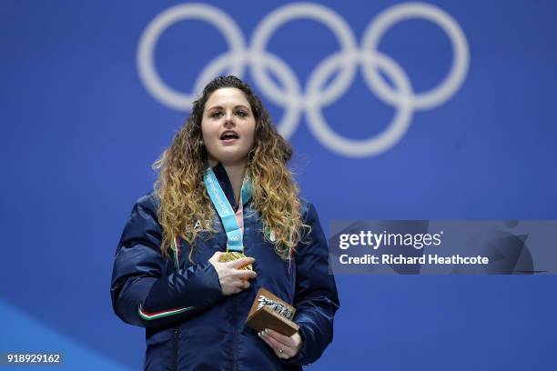 Gold medalist Michela Moioli of Italy sings along to the anthem during the Medal Ceremony for Ladies' Snowboard Cross on day seven of the PyeongChang...