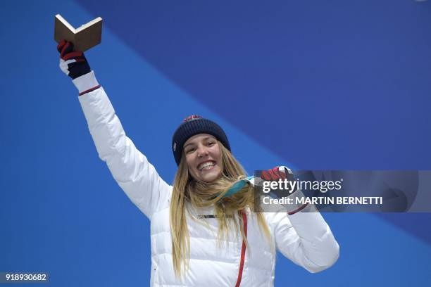 France's silver medallist Julia Pereira de Sousa Mabileau poses on the podium during the medal ceremony for the women's snowboard cross at the...