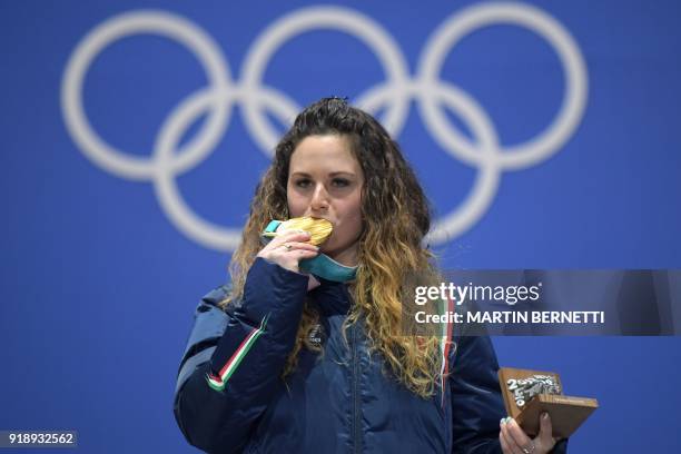 Italy's gold medallist Michela Moioli poses on the podium during the medal ceremony for the women's snowboard cross at the Pyeongchang Medals Plaza...