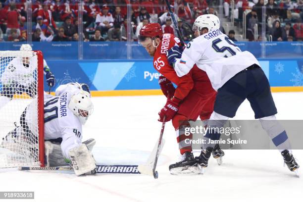 Luka Gracnar of Slovenia tends goal against Mikhail Grigorenko of the Olympic Athletes from Russia during the Men's Ice Hockey Preliminary Round...