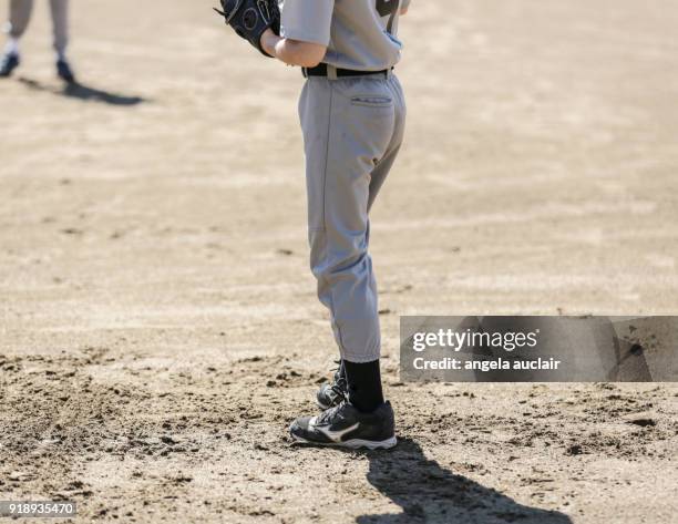 young boy playing baseball - angela auclair stock pictures, royalty-free photos & images