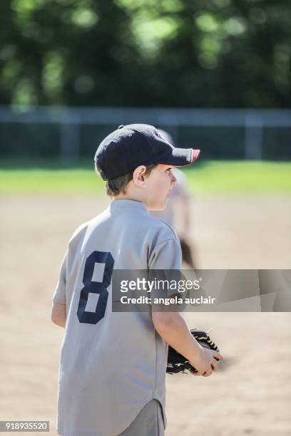 young boy playing baseball - angela auclair stock pictures, royalty-free photos & images
