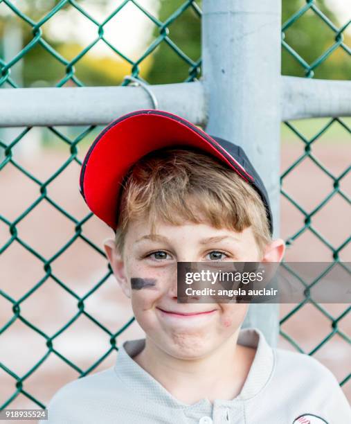 young boy playing baseball - angela auclair stock pictures, royalty-free photos & images