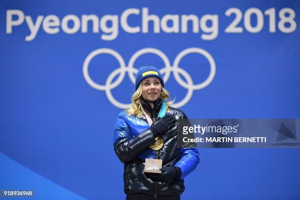 Sweden's gold medallist Frida Hansdotter poses on the podium during the medal ceremony for the alpine skiing women's slalom at the Pyeongchang Medals...