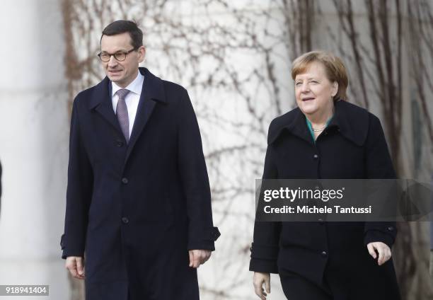 German Chancellor Angela Merkel chats with new Polish Prime Minister Mateusz Morawiecki upon Morawiecki's arrival at the Chancellery on February 16,...