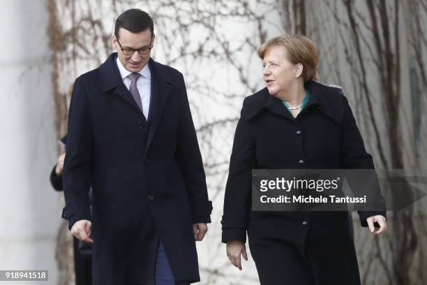 German Chancellor Angela Merkel chats with new Polish Prime Minister Mateusz Morawiecki upon Morawiecki's arrival at the Chancellery on February 16,...