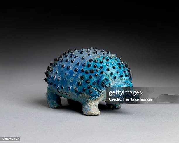 Faience figurine of a hedgehog, Middle Kingdom . Dimensions: height: 3.8 cmlength: 6.4 cm Artist Unknown.