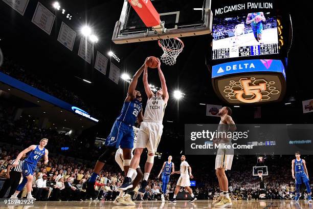 Ben Lammers of the Georgia Tech Yellow Jackets battles Marques Bolden of the Duke Blue Devils for a rebound during the basketball game at Hank...