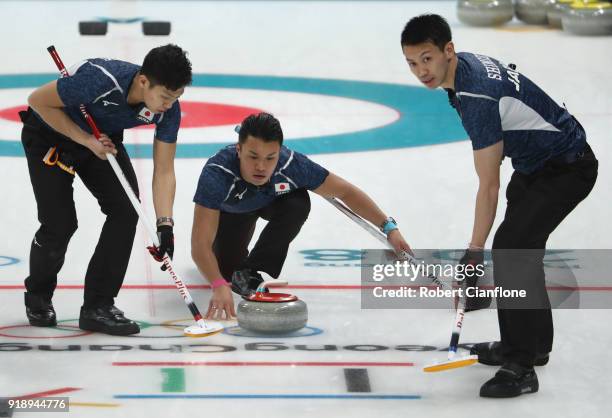 Tetsuro Shimizu and Tsuyoshi Yamaguchi of Japan delivers a stone in the Curling Men's Round Robin Session 5 held at Gangneung Curling Centre on...