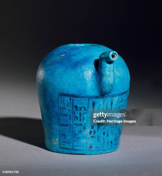 Spouted faience vessel with inscription, XXIst Dynasty, . Vase, form 70L, Riggeh Corpus, with S-curved spout. Blue glaze. Inscription in black in six...