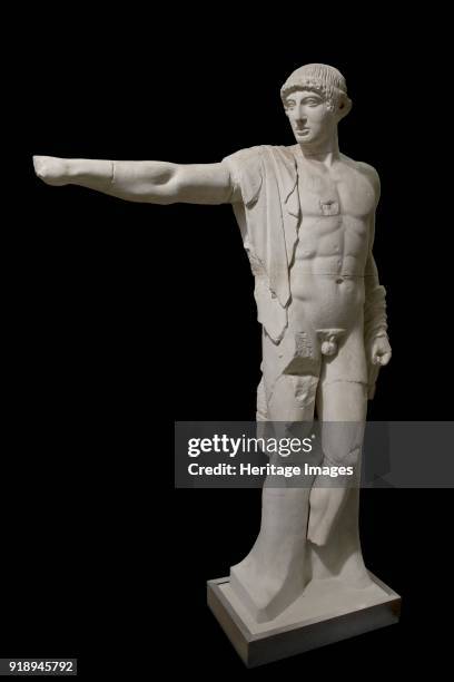 One of a set of sculptures and metopes from temple of Zeus at Olympia, c460 BC. Apollo , west pediment, 460 BC. Figure of naked Apollo . The hair,...