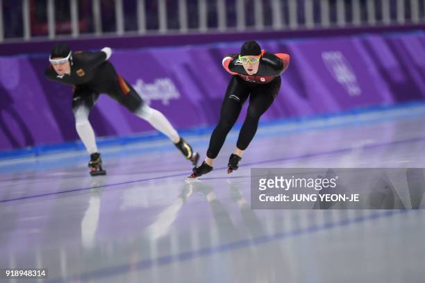 Canada's Ivanie Blondin and Germany's Claudia Pechstein compete in the women's 5,000m speed skating event during the Pyeongchang 2018 Winter Olympic...