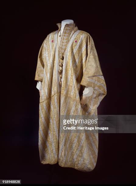 Arab robe worn by TE Lawrence, 1916. Dimensions: height x width: width at hem 133.5 x 143.5 cmlength: tassle 37.5 cm