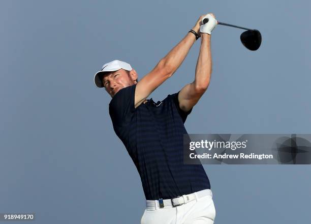 Chris Wood of England tees off on the par for 18th hole during the second round of the NBO Oman Open at Al Mouj Golf on February 16, 2018 in Muscat,...