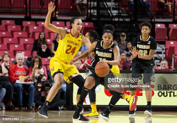 Purdue Boilermakers guard Dominique Oden dribbles the ball in front of Maryland Terrapins forward Stephanie Jones during a Big10 women's basketball...