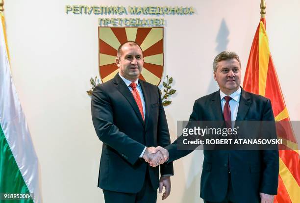 Macedonian President Gjorge Ivanov shakes hand with his Bulgarian counterpart Rumen Radev as he greets him upon his arrival on February 16, 2018 in...