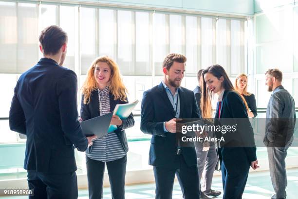 business discussion - male with group of females stock pictures, royalty-free photos & images