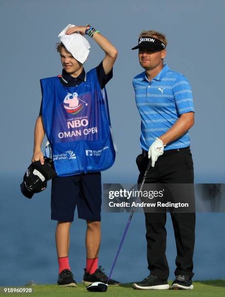 Soren Kjeldsen of Denmark and his son Emil on the par for 18th tee during the second round of the NBO Oman Open at Al Mouj Golf on February 16, 2018...